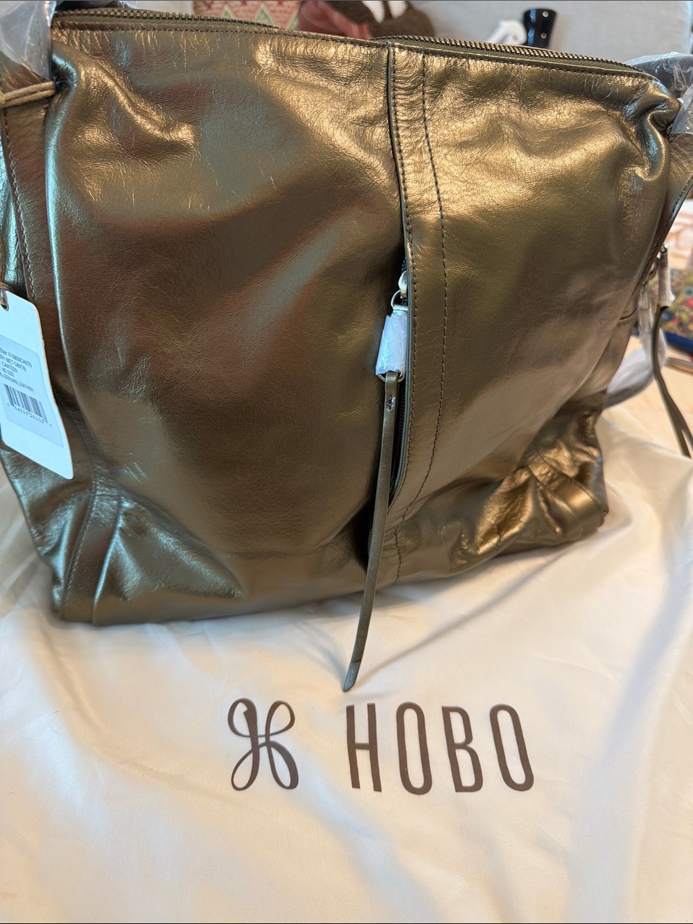 HOBO Century Metallic Leather Hobo Shoulder Bag
The color is canteen.